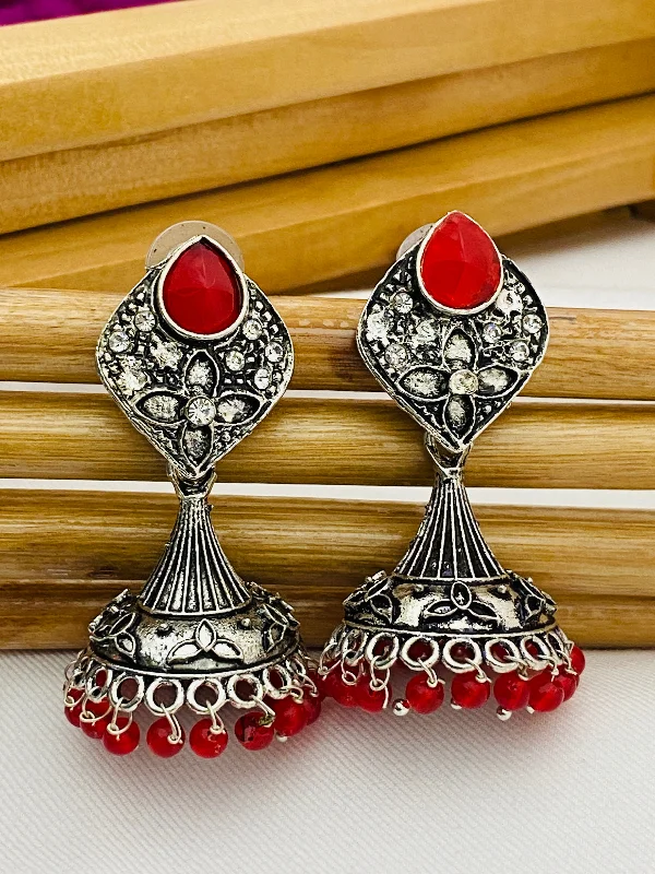 pearl drop earrings for women -Alluring Red Stone Studded Floral Design German Silver Plated Oxidized Jhumka Earrings For Women